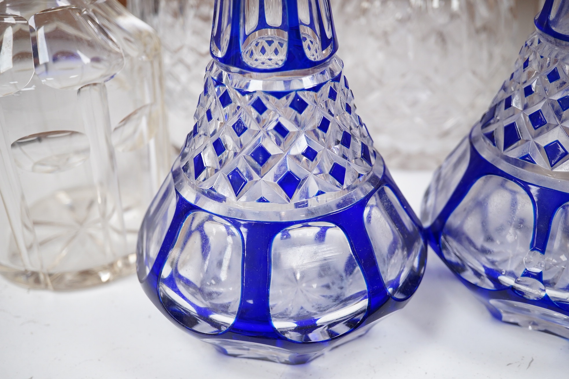 A near pair of blue flashed decanters and stoppers and four other decanters and stoppers, tallest blue flash decanter and stopper, 34cm high (6). Condition - fair to good